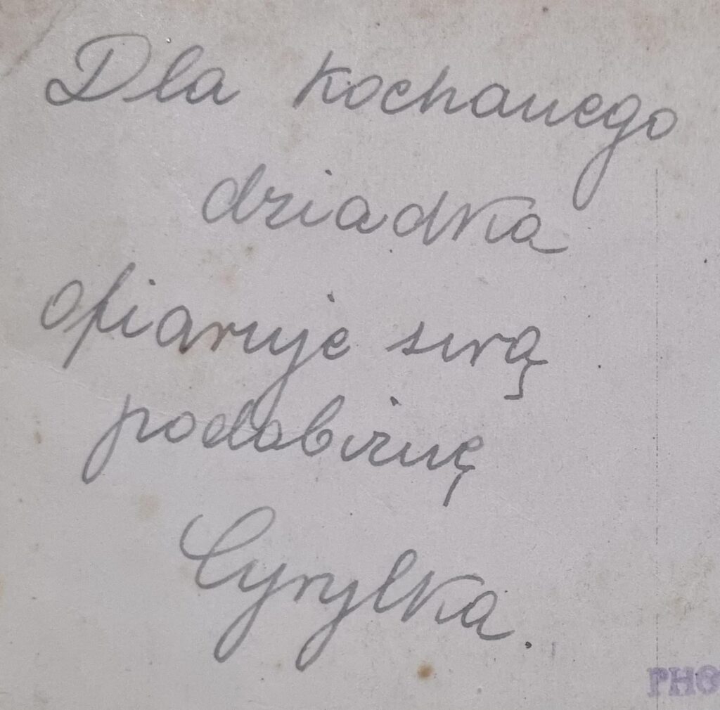 Please, would anyone help to translate this photo inscription? Particularly her name.