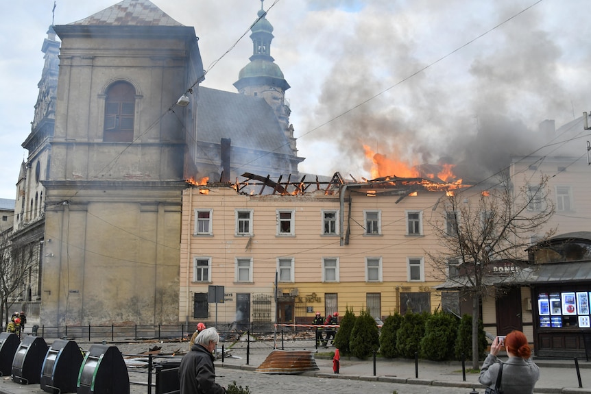 Firefighters tackle a blaze in a tall building 