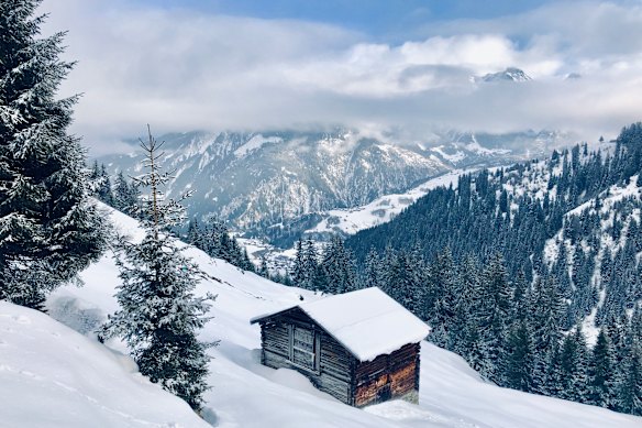 A snow-covered hutte in Switzerland’s Graubunden region.