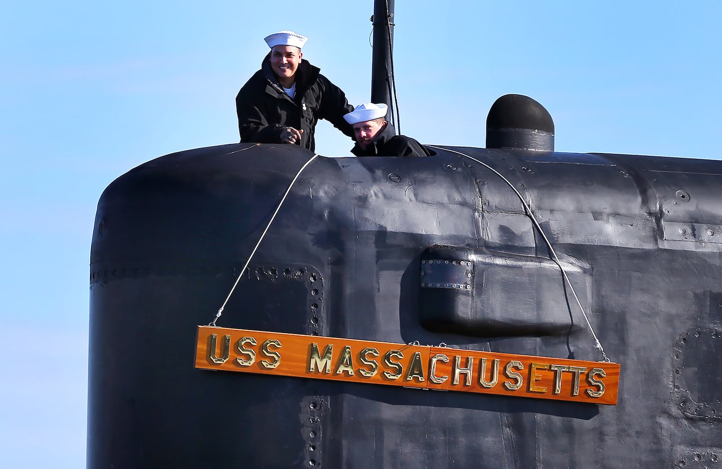 Sailors stood at the top of the sail of the USS Massachusetts submarine during the ceremony.