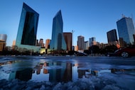 Following the winter storm, shards of ice are slowly melting before the downtown Dallas...