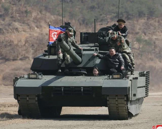 A rare picture: conscript Diva Perković Thompson drives Minister Anušić around the training ground after successfully completing the training.
