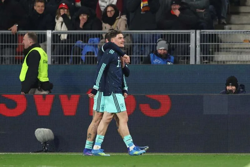 Germany's Florian Wirtz celebrates his side's third goal of the game during the International Friendly soccer match between Switzerland and Germany at St. Jakob Park. Christian Charisius/dpa