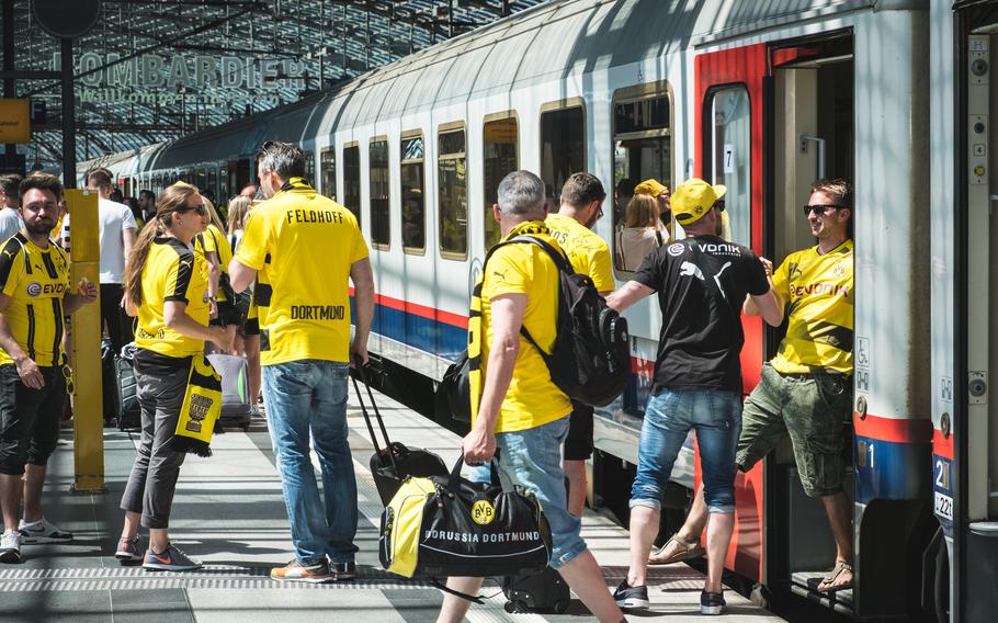 German football fans are dedicated, taking the Duetsch Bahn to games and flocking to matches. 