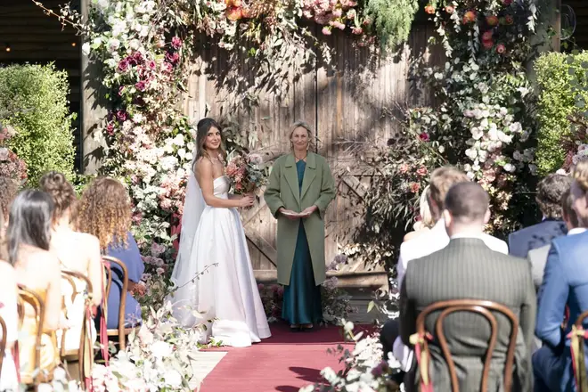 Mel pictured waiting alone at the altar.