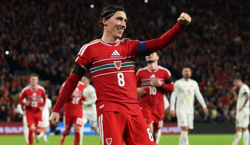 Wales' Harry Wilson celebrates scoring their sixth goal.