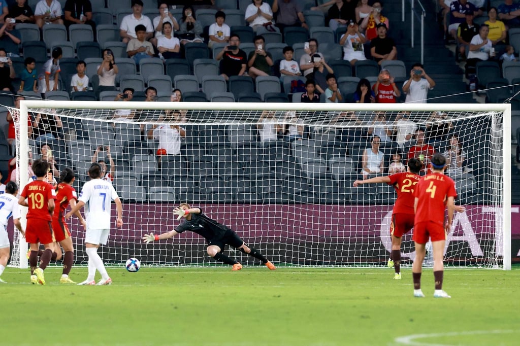 Shao Ziqin (second from right) scores with a penalty for China’s first goal in their 3-0 win. Photo: AFP