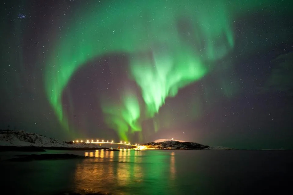 Aurora Borealis display over Sommaroy Bridge in Northern Norway.