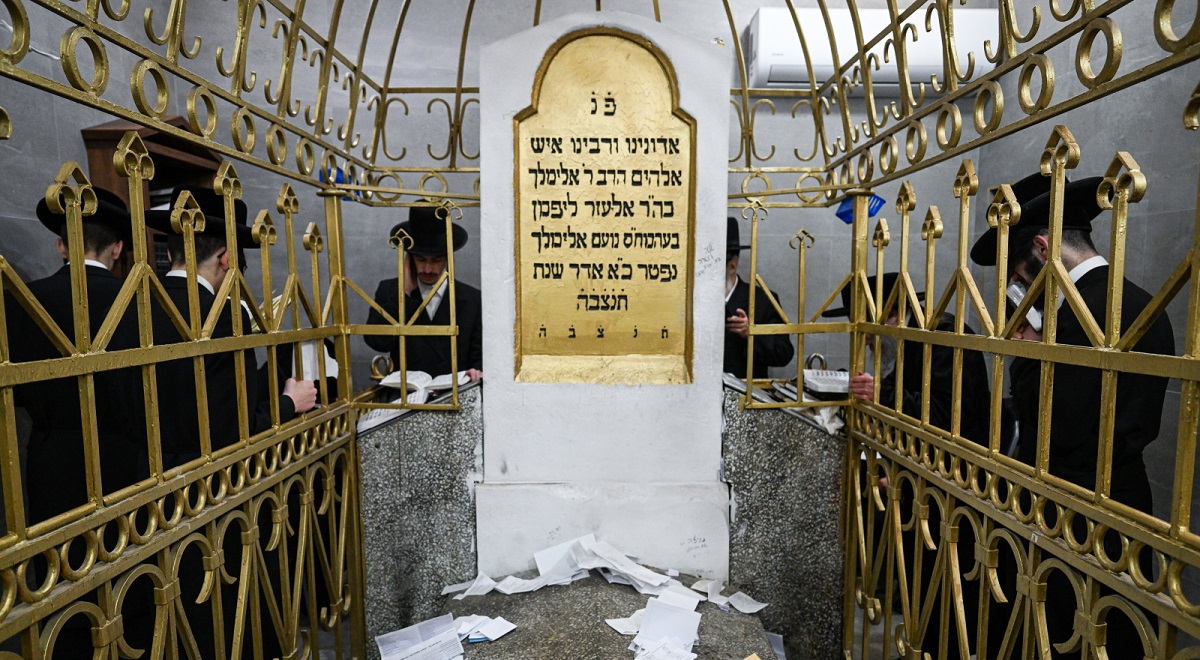 Pilgrims pray in Leżajsk on Monday.