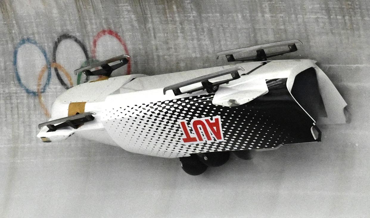 Milano Cortina 2026 Olympics - Bobsleigh - 4-man Heat 2 - Cortina Sliding Centre, Cortina d'Ampezzo, Italy - February 21, 2026. Jakob Mandlbauer of Austria, Daniel Bertschler of Austria, Sebastian Mitterer of Austria, Daiyehan Nichols-Bardi of Austria crash during Bobsleigh - 4-man Heat 2 REUTERS/Annegret Hilse