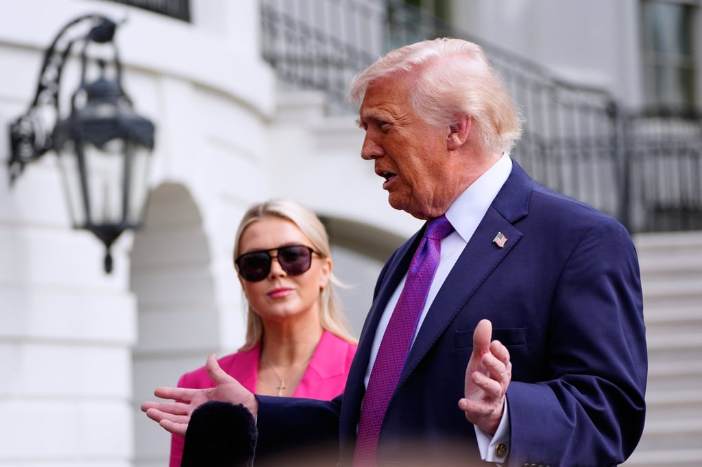 US President Donald Trump speaks to reporters on the South Lawn of the White House, in Washington, on March 11, as White House press secretary Karoline Leavitt looks on. Photo: AP