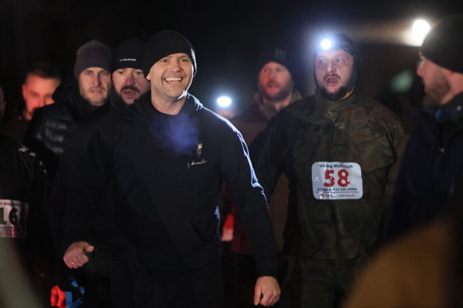 Commemorations marking the National Day of Remembrance of the Cursed Soldiers - Polish President Karol Nawrocki (L) during the 7th Cursed Soldiers Run in the village of  Wilczoruda, western Poland, March 1, 2026.