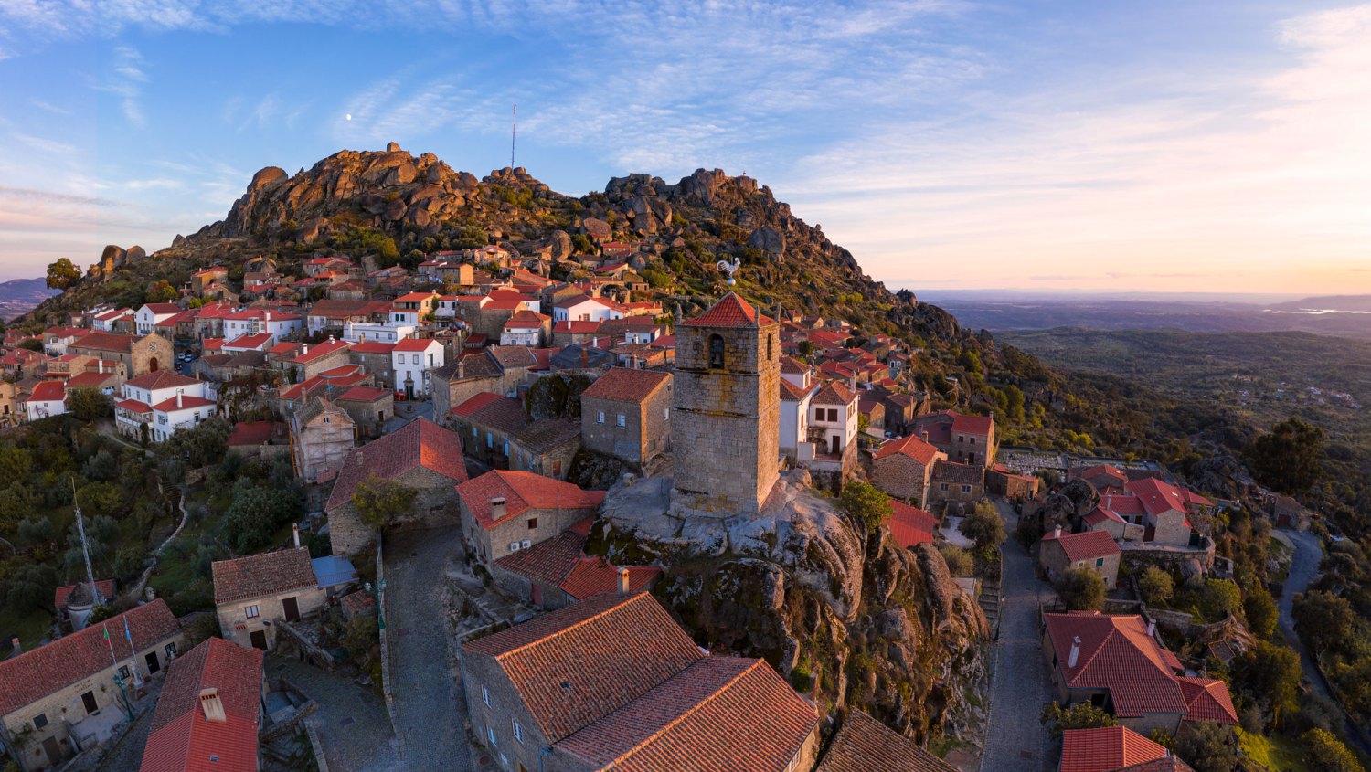 House of the Dragon Filming Location-Drone aerial panorama view of Monsanto historic village at sunset, in Portugal