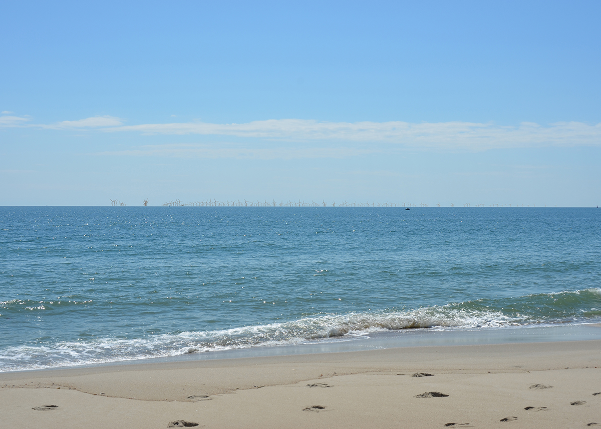 This image from a visualization study commissioned by the Southeast Wind Coalition in 2022 for the Carolina Long Bay offshore wind project that is now scuttled shows how the turbines would appear from the beach at Bald Head Island.