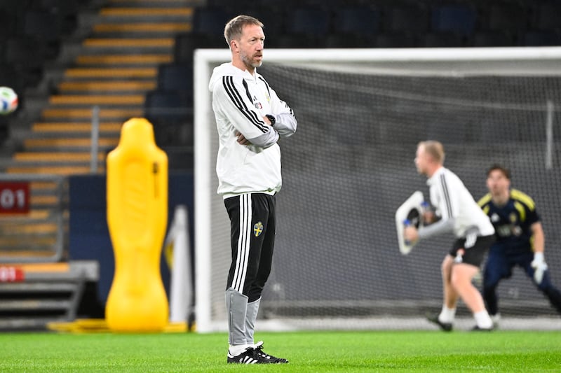 Sweden head coach Graham Potter looks on during a training session at Strawberry Arena in Stockholm ahead of the playoff final against Poland. Photograph: Fredrik Sandberg/AFP via Getty Images