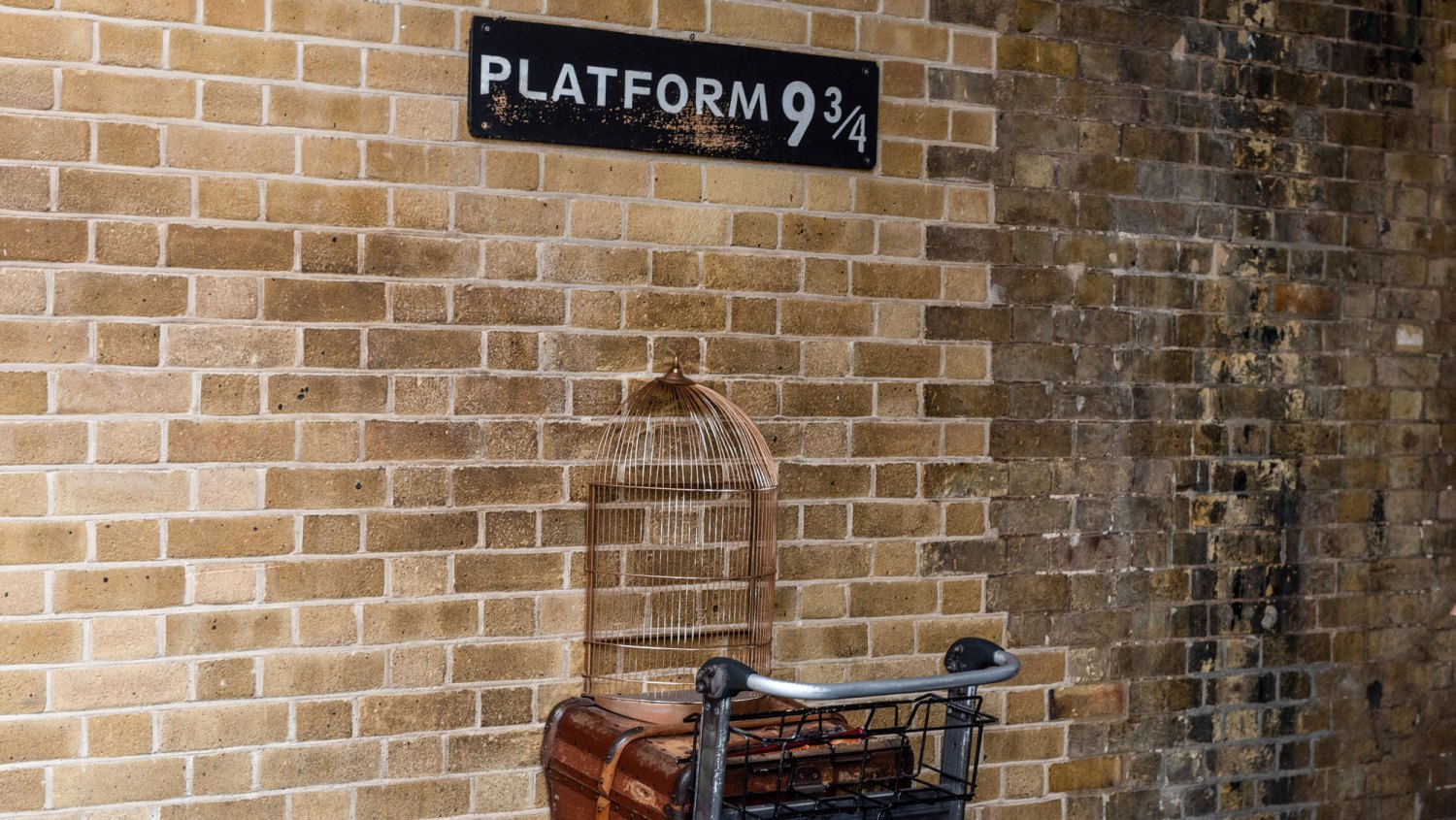 LONDON, UNITED KINGDOM: Famous fictional Platform 9 and 3/4s Kings Cross Station London, scenes and locations from the movies of the Harry Potter stories by JK Rowling.