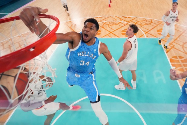 Giannis Antetokounmpo #34 of Team Greece dunks the ball during the mens' quarterfinal match between Team Germany and Team Greece on day eleven of the Olympic Games in Paris at Stade Pierre Mauroy on Aug. 06, 2024 in Lille, France. (Photo by Pool/Getty Images)