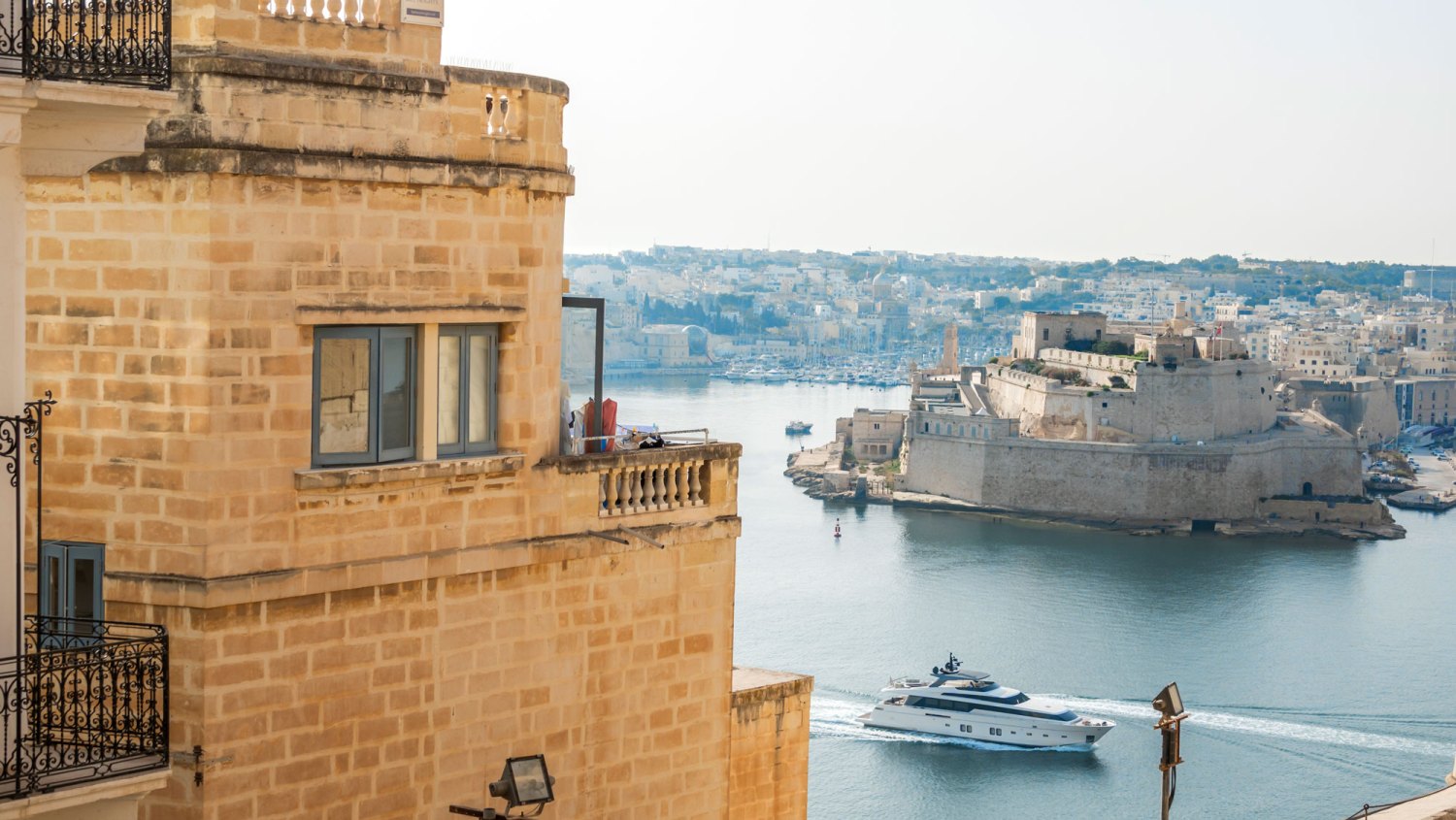 Gladiator location Valletta, Malta, Grand Harbor, Upper Barrakka Gardens, Fort Ricasoli fortress, limestone buildings.