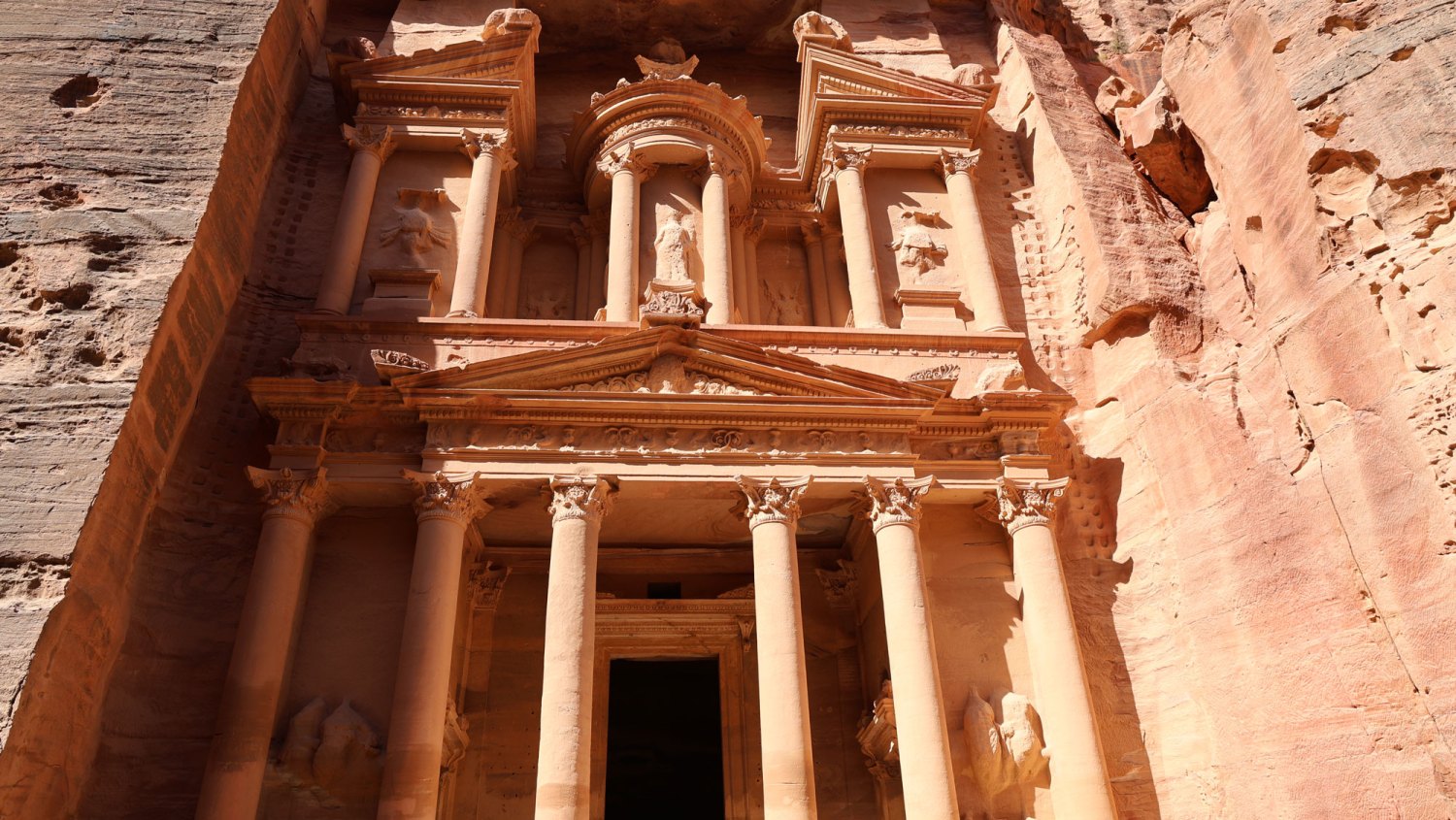 INDIANA JONES LOCATION—PETRA, JORDAN - SEPTEMBER 26 Tourists and diplomats participating in a tourism summit tour Petra walking through the Siq that ends at the Treasury on September 26, 2025 in Petra, Jordan. The Petra Development and Tourism Region Authority is marking World Tourism Day on September 27 with a "New Seven Wonders Summit" and program of events taking place this week to celebrate the iconic Petra UNESCO World Heritage Site. Petra, an ancient Nabataean city, is a significant archeological site known for its architecture carved from rose-colored sandstone and the Nabataean's impressive water conduit engineering, which draw tourists from around the world to the historical valley in south Jordan.