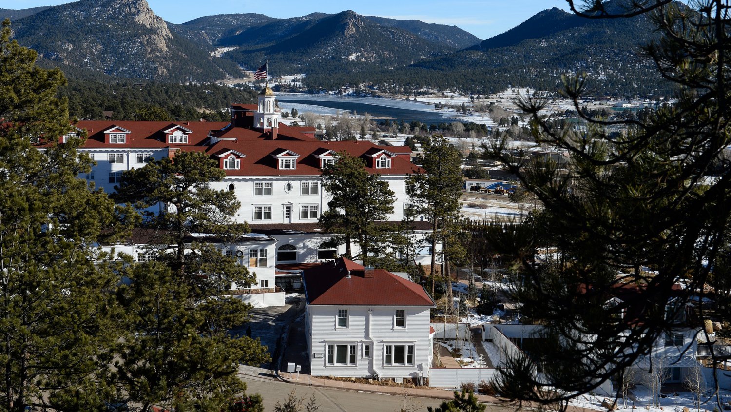 The popular Stanley Hotel in Estes Park, Colorado. ESTES PARK, CO - JANUARY 12: The beautiful Stanley Hotel is pictured from high above on January 12, 2016 in Estes Park, Colorado. The hotel is located 10.4 miles from the Rocky Mountain National Park. The grand, upscale hotel dates back to 1909. The Stanley Hotel, known for its architecture, magnificent setting, and famous visitors, may possibly be best known today for its inspirational role in the Stephen King's novel, The Shining. This Colorado hotel has been featured as one of America's most haunted hotels and with the numerous stories from visitors and staff.