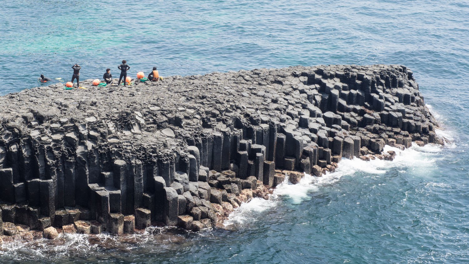 Filming Location for When Life Gives you Tangerines-Female divers, called Haenyeo, prepare for the diving at the Jusangjeolli volcanic rock formation, which is one of main tourist spots of Jeju Island.Seogwipo-si, Jeju-do, South Korea