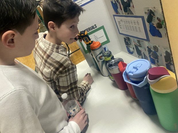 Valley Elementary/Middle School fourth grader Cooper Maue and Giovanni Mariano explain there science fair project about Which Water Bottle keeps Water Cold the Longest on Wednesday Feb. 25, 2026.(John Haeger / Staff Photographer)