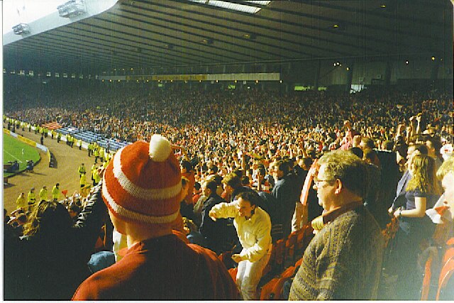 Hampden Park, Scottish Cup Semi-Final Day. Aberdeen fans stand up to acclaim a late equalizer by Duncan Shearer against Hearts in a Scottish Cup Semi Final at Scotland's national football stadium.