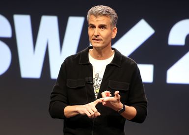 Josh D'Amaro speaking at a Disney event.