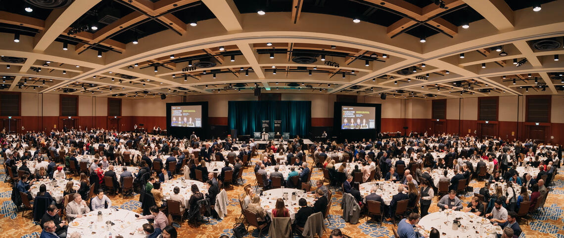 Panoramic perspective of attendees enjoying lunch