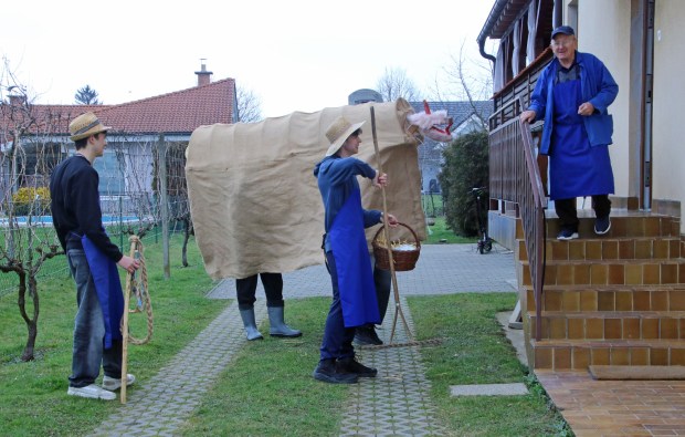 The rusa is a goofy carnival character bringing health and fertility for horses and other domestic animals. This entourage is doing a home visit in the Slovenia town of Cirkulane. (Photo by Norma Meyer)