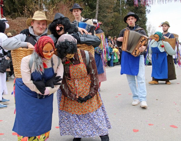 The "old woman carrying the old man" is a staple of Shrovetide carnivals in Ptuj and surrounding areas. These couples are in the community of Cirkulane. (Photo by Norma Meyer.