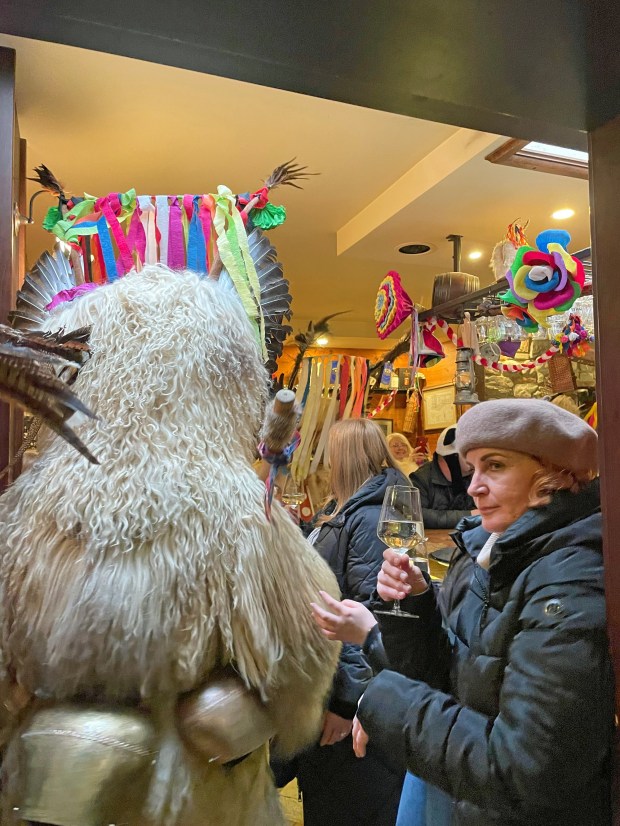 Rambunctious Kurents walk into the bar at Gostilna Rozika in Ptuj. (Photo by Norma Meyer)