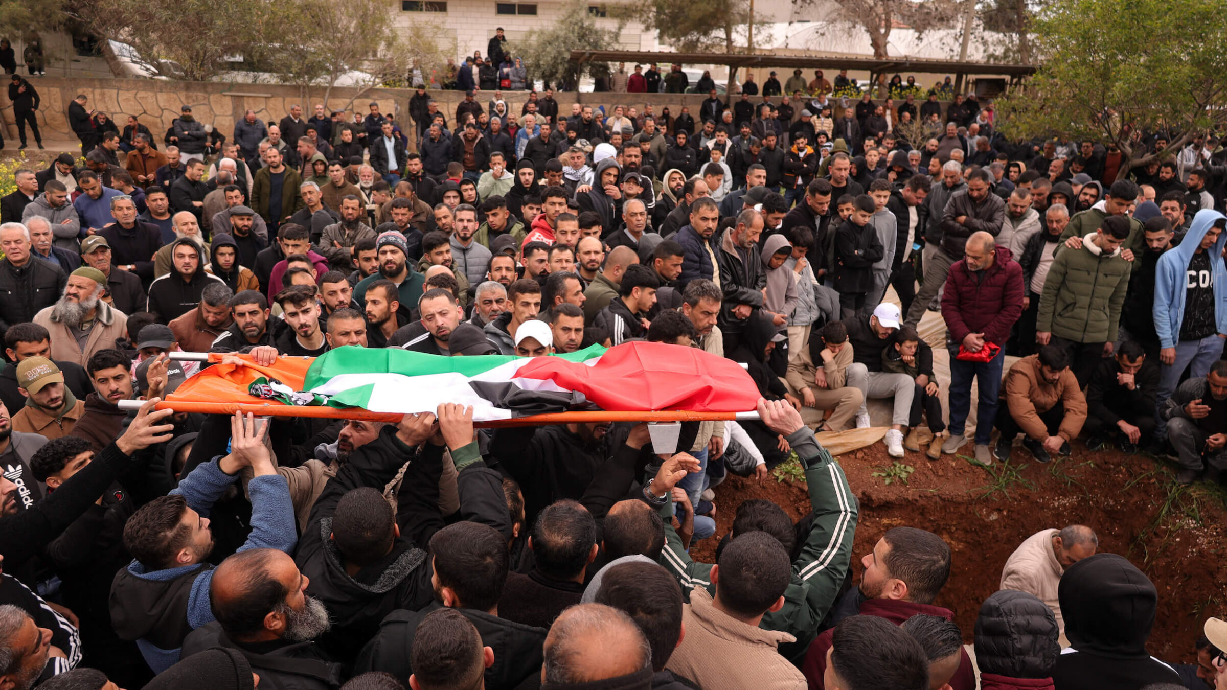 Palestinian mourners carry coffins during the funeral of four members of the Bani Odeh family, who were killed by undercover Israeli soldiers in the occupied West Bank on March 15.