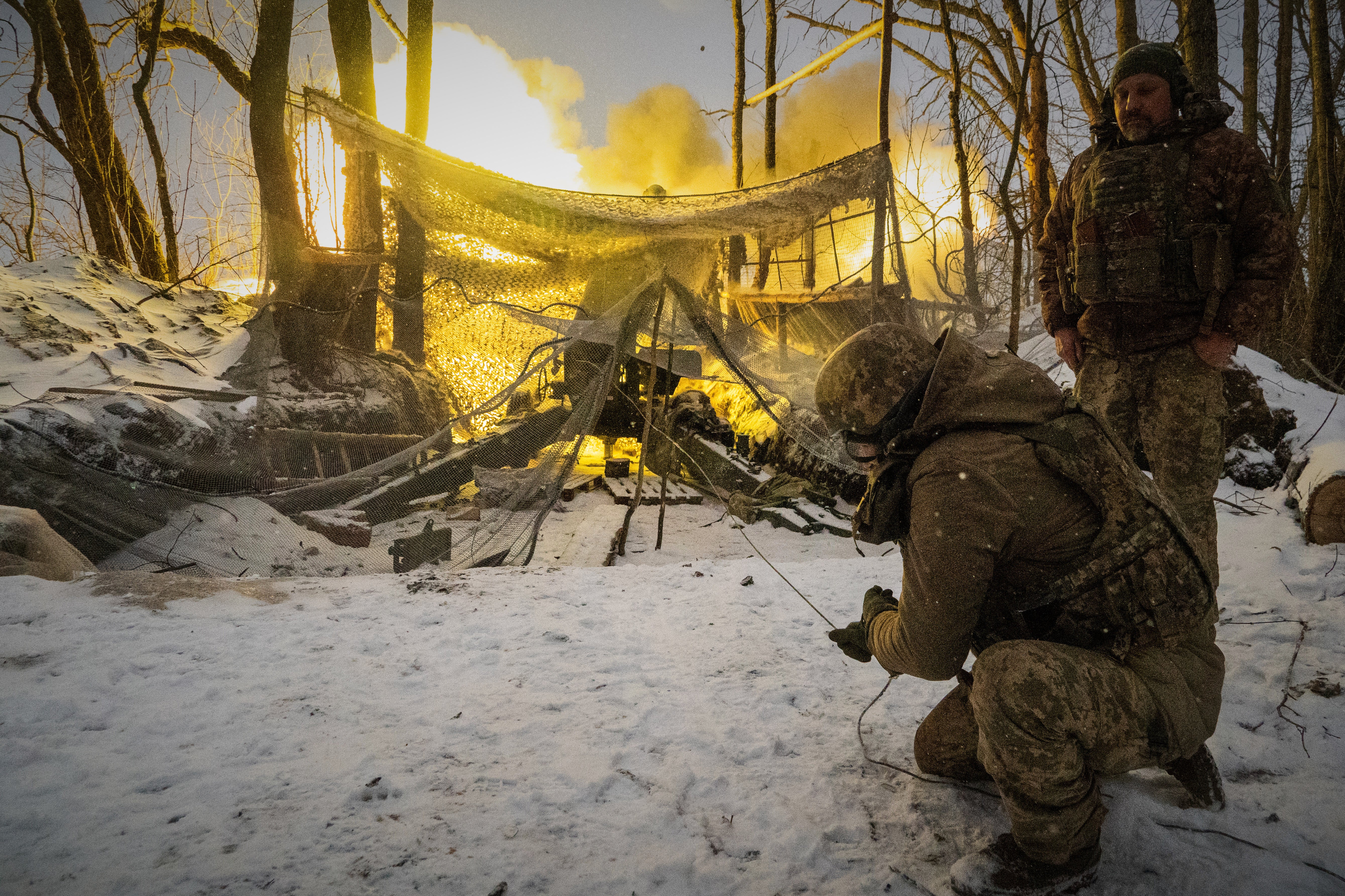 Ukrainian soldiers fire at Russian positions on the front line in the Kharkiv region of Ukraine, Wednesday, Feb. 18, 2026