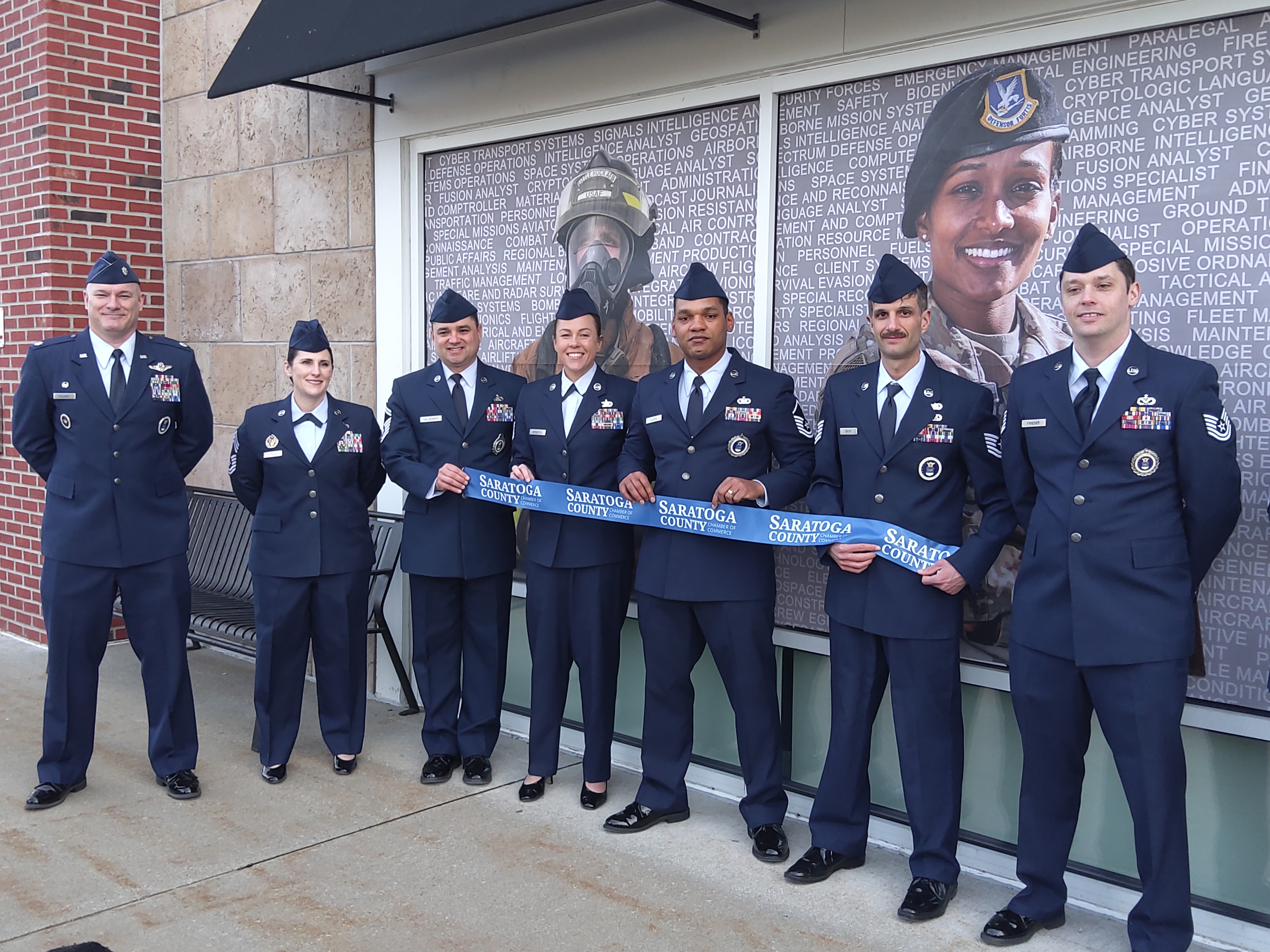 Members of the US Air Force show off the ribbon that they will keep in their new Malta office for good luck. (Melissa Schuman - MediaNews Group)