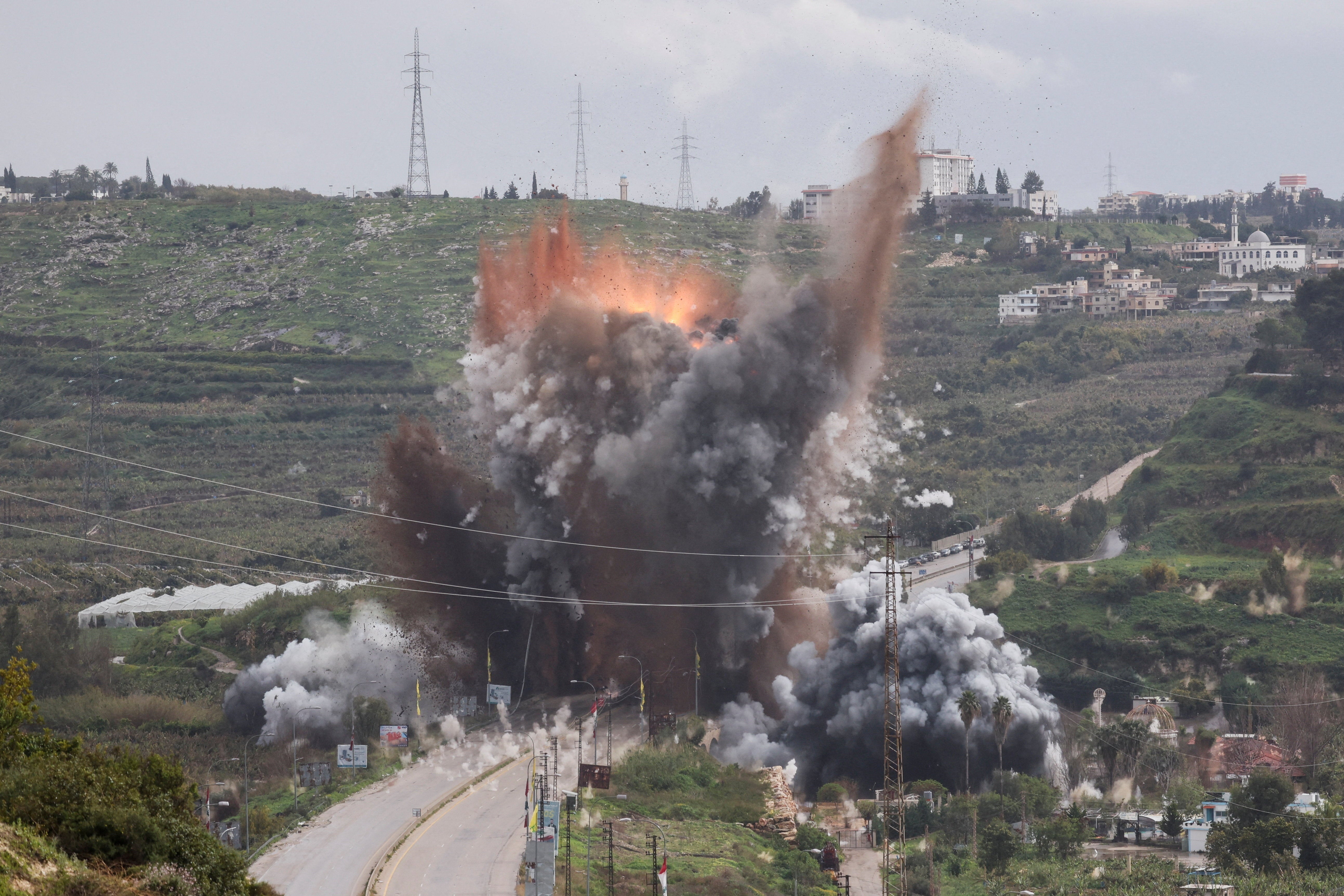 Smoke rises after an Israeli strike on a bridge on Sunday near Qasmiyeh in Lebanon