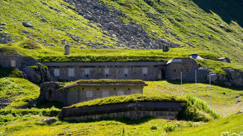 Artillery bunker fortification surrounded by meadow at Swiss mountain pass St. Gotthard 