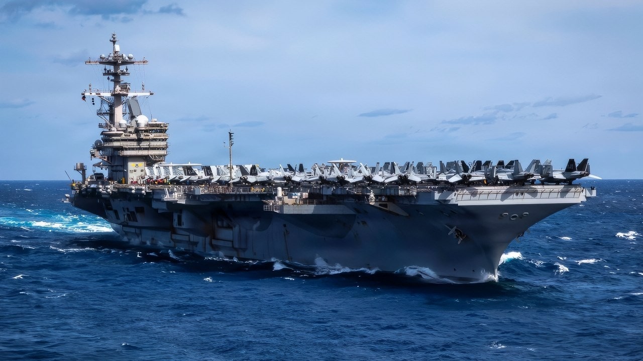 The Nimitz-class aircraft carrier USS George H.W. Bush (CVN 77) transits the Atlantic Ocean, Feb. 15, 2026. The George H.W. Bush Carrier Strike Group is at sea training as an integrated warfighting team. Composite Training Unit Exercise (COMPTUEX) is the Joint Force’s most complex integrated training event and prepares naval task forces for sustained high-end Joint and combined combat. Integrated naval training provides combatant commanders and America’s civilian leaders highly capable forces that deter adversaries, underpin American security and economic prosperity, and reassure Allies and partners. (U.S. Navy photo by Mass Communication Specialist 2nd Class Mitchell Mason)