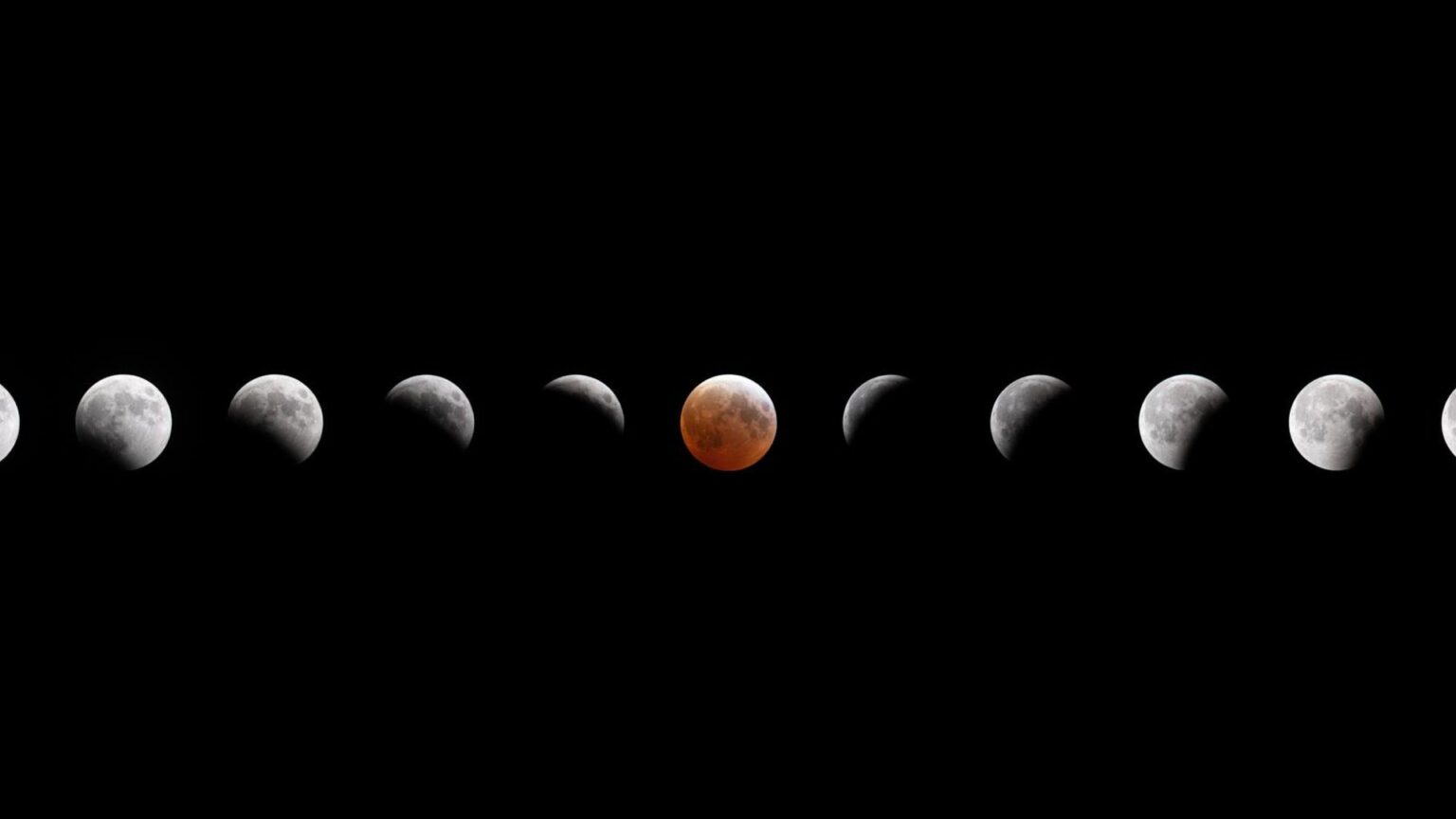A composite image showing the small gray sphere of the moon across a dark night sky as it reaches various phases of a lunar eclipse.