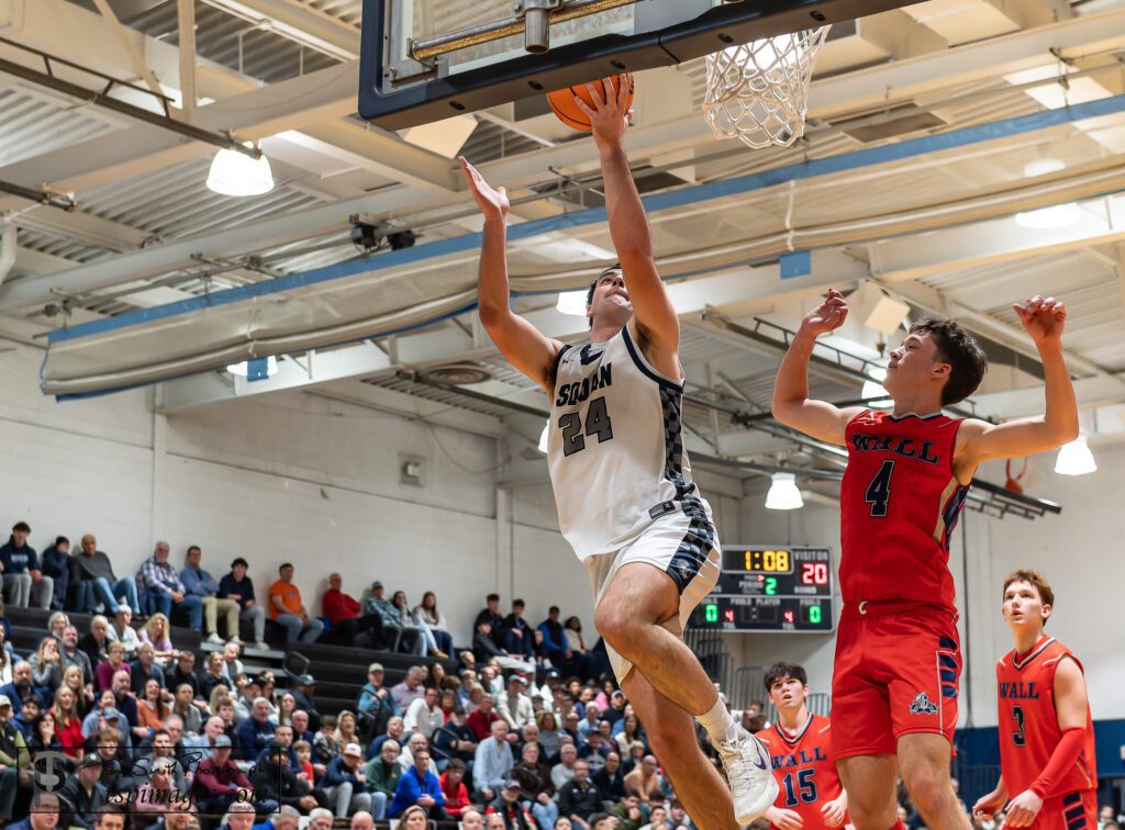 Manasquan senior Jack O'Reilly drives for a layup against Wall senior Dan Hennessy. (Photo: Tom Smith | tspsportsimages.com) - Wall vs Manasquan SCT