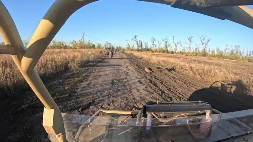 Russian soldiers on a buggy car under attack of FPV-drone (NSFW Graphic)