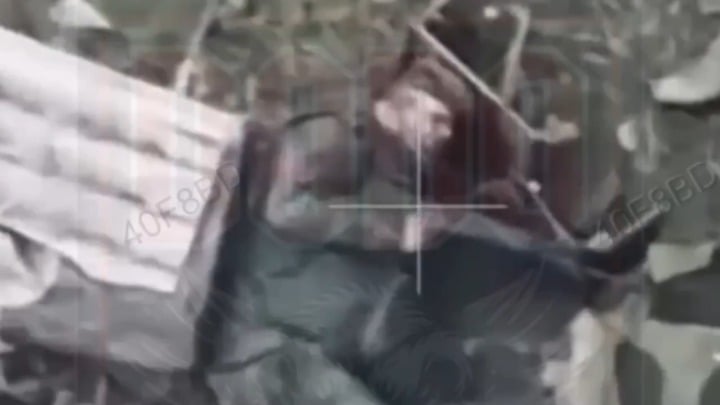 NSFW gore. A russian soldier has his head shot off from a Ukrainian MG gunner. March 2026