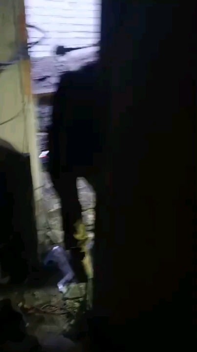 A Ukrainian soldier picks up an unexploded drone that flew into his position and throws it out the window. DO NOT TRY AT HOME!