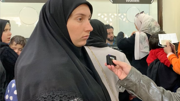 Fatimah, a Syrian woman who left her country for Lebanon during the civil war waits to re-enter at Syria's Jdeidet Yabous border crossing. She said she left her southern Lebanon home with the clothes on her back and her children. 