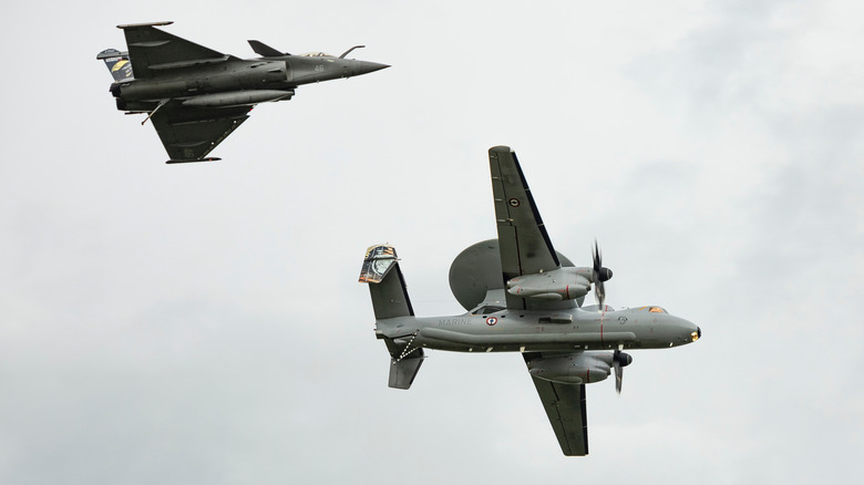 Rafale fighter and E-2C Hawkeye in flight