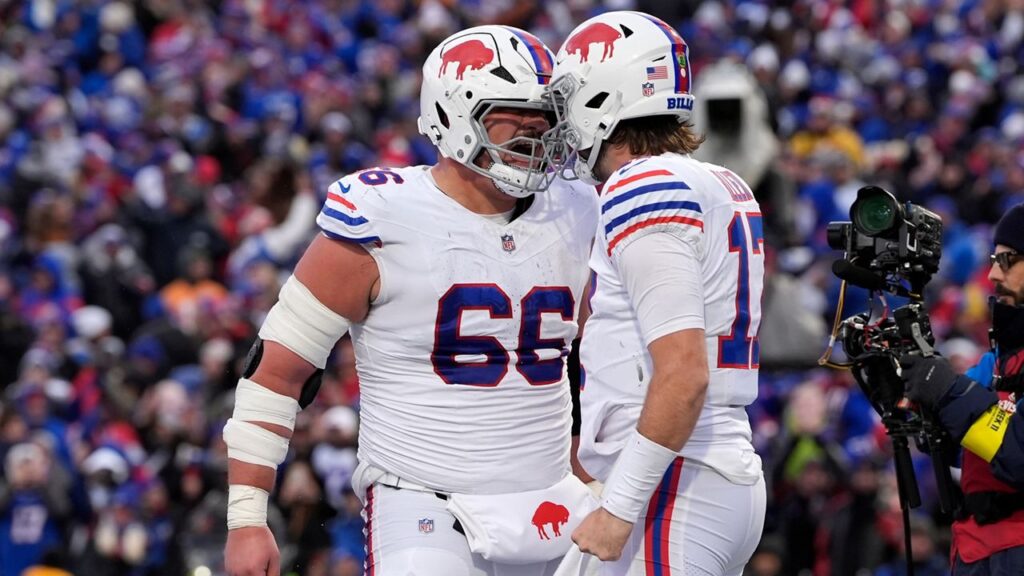Buffalo Bills quarterback Josh Allen, right, celebrates with guard Connor McGovern (66) after scoring a touchdown during the second half of an NFL football game, Sunday, Nov. 16, 2025, in Orchard Park, N.Y.