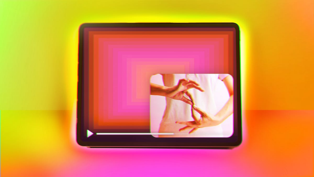 A tablet with a person signing in a window in the corner