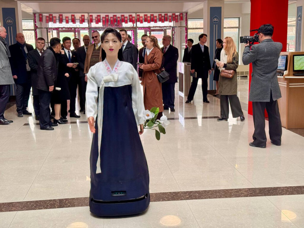 A guide robot dressed in hanbok (traditional Korean dress) welcomes voters and explains the voting process at a polling station set up at the library of Pyongyang Teachers Training College during North Korea’s Supreme People’s Assembly election on March 15, in this image shared by the Russian Embassy in North Korea. [YONHAP]