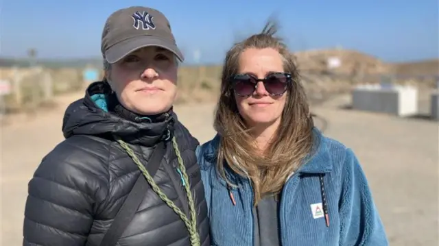 Friends Yvette Duncan and Laura Seddon stood together at the beach.