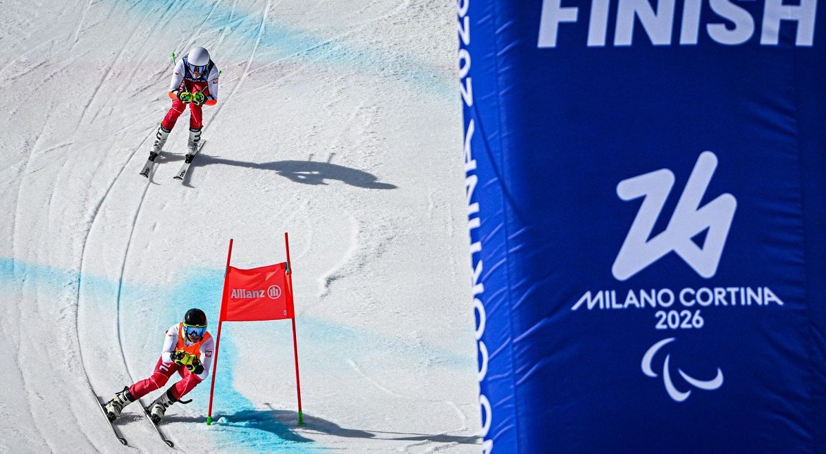 Polish visually impaired skier Michał Gołaś and his sighted guide Kacper Walas in action at the Milan-Cortina 2026 Paralympic Winter Games in Italy.